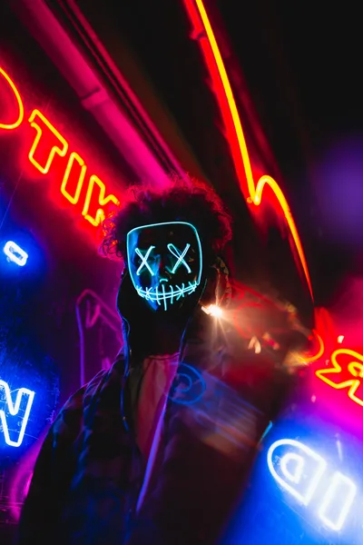 Neon Anonymous: LED Mask in Colorful Darkness - free photography wallpaper 3648×5472