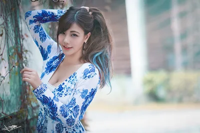 Woman in Blue and White Floral Áo Dài by Weathered Wall - free people & portraits wallpaper 5760×3840