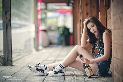 Woman Sitting in Alley Holding Phone - free people & portraits wallpaper 5760×3840