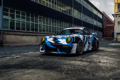 Blue and White Racing Porsche in Industrial Warehouse - free cars & vehicles wallpaper 2048×1367