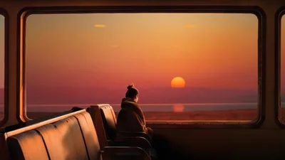 Solitary Sunset: A Train Journey Through Golden Hour - free photography wallpaper 3840×2160