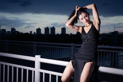 Urban Elegance: Asian Woman Portrait Against City Skyline - free wallpaper 6144×4096