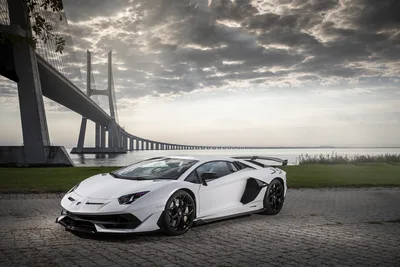 White Supercar By The Bridge Under Dramatic Skies - free wallpaper 5472×3648