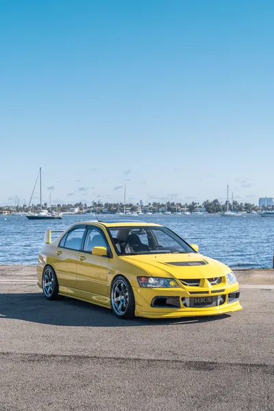 Yellow Sports Sedan by the Bay - free cars & vehicles wallpaper 6336×9504