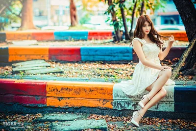 Woman in White Dress Posing on Colorful Wooden Logs - free people & portraits wallpaper 5760×3840