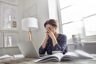 Woman at Desk Experiencing Stress While Working on Laptop - free people & portraits wallpaper 5120×3413