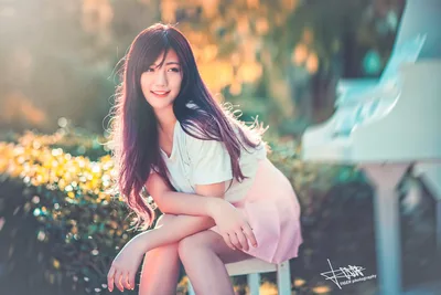 Young Woman Posing in Garden with Golden Flowers - free people & portraits wallpaper 5120×3414