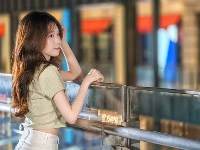 Woman in Green Top at Shopping Mall Railing - free people & portraits wallpaper 4096×3072