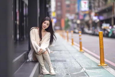 Woman in Cream Cardigan Posing on Urban Sidewalk - free people & portraits wallpaper 5120×3418