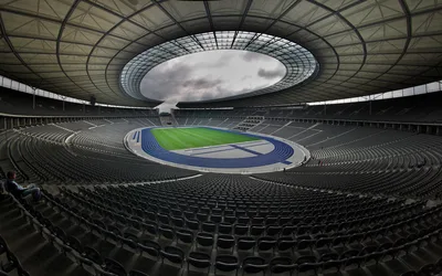 Modern Olympic Stadium with Empty Seats and Blue Track - free photography wallpaper 2560×1600