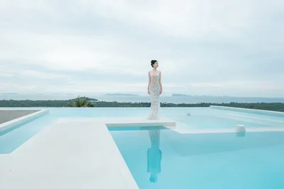 Woman in White Lace Dress by Infinity Pool Overlooking Ocean - free people & portraits wallpaper 6000×4000