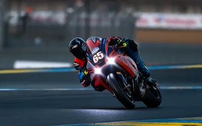 Motorcycle Racer Number 65 Leaning Into Turn at Dusk - free cars & vehicles wallpaper 4072×2545