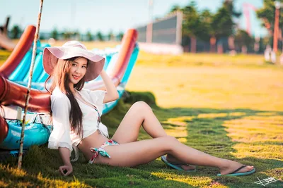Woman in White Posing by Colorful Boat in Yellow Field - free people & portraits wallpaper 5760×3840