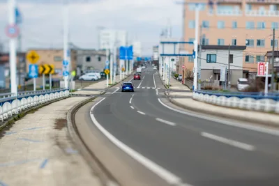 Japanese Suburban Street With Curved Road and Buildings - free cars & vehicles wallpaper 5568×3712