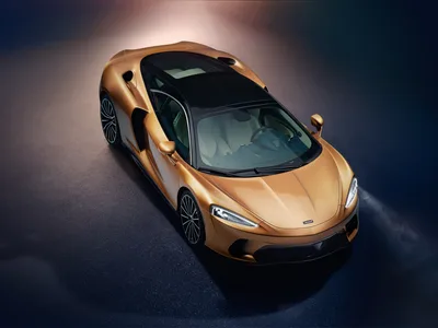 Golden Sports Car Overhead View on Wet Surface - free cars & vehicles wallpaper 8000×6001