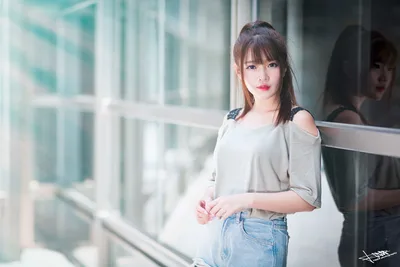 Young Woman in Casual Wear by Modern Glass Building - free wallpaper 5760×3840