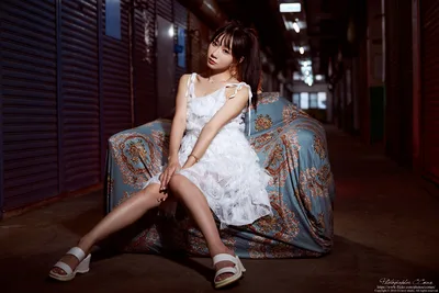 Woman in White Dress Sitting on Patterned Fabric at Night - free people & portraits wallpaper 4340×2894