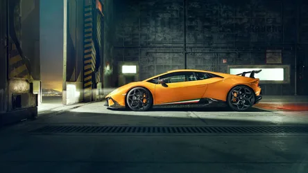 Orange Sports Car in Industrial Warehouse Setting - free cars & vehicles wallpaper 4096×2304