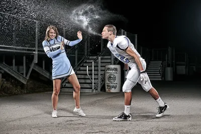 Cheerleader and Football Player at Night Stadium - free sports wallpaper 6048×4032
