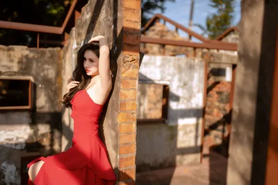Woman in Red Dress Posing by Brick Pillar - free people & portraits wallpaper 6144×4098