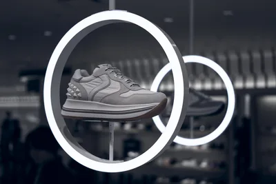Sneaker Display in Neon-Lit Circular Frame - free photography wallpaper 5120×3414
