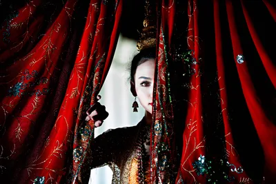 Woman Peering Through Ornate Red Embroidered Curtains - free people & portraits wallpaper 6144×4098