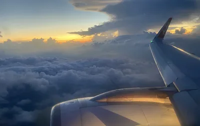 Airplane Wing Above Cloud Layer at Sunset - free cars & vehicles wallpaper 3952×2488
