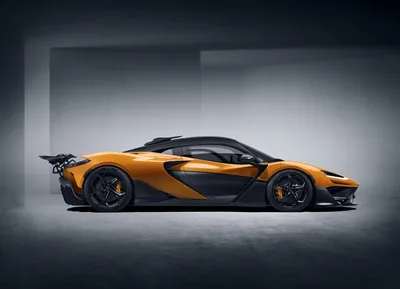 Orange and Black Supercar in Modern Studio Setting - free cars & vehicles wallpaper 10000×7228
