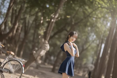 Woman in Navy Dress Posing on Tree-Lined Path - free people & portraits wallpaper 6144×4096