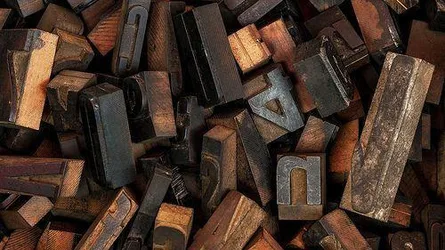 Wooden Type Scattered in Morning Light - free art & design wallpaper 500×281