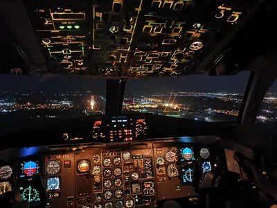 Cockpit Above the Glowing City Night - free wallpaper 3000×2250