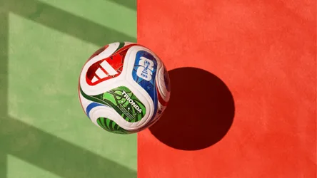 Soccer Ball on Vibrant Flag Background with Shadow - free sports wallpaper 1920×1080
