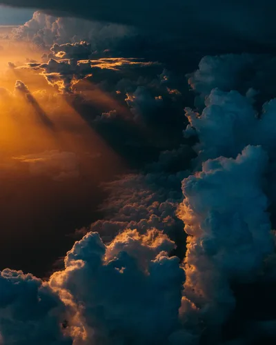 Golden Light Through Storm Clouds - free wallpaper 3000×3750