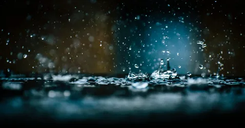 Starlit Rain Over Midnight Waters - free space wallpaper 5710×2986