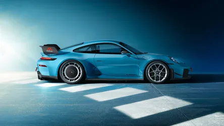 Blue Sports Car in Sunlit Studio - free cars & vehicles wallpaper 7680×4320