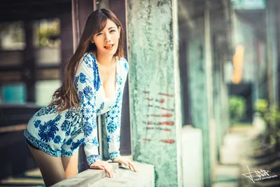 Woman in Blue and White Porcelain-Patterned Jacket - free wallpaper 5760×3840
