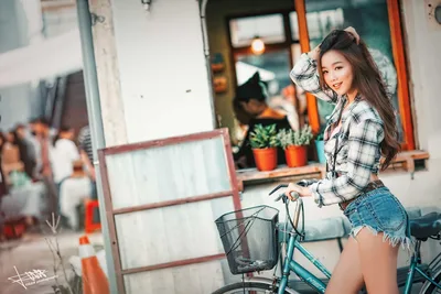 Young Woman With Bicycle on Urban Street - free wallpaper 5760×3840