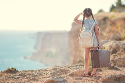 Young Girl with Suitcase Overlooking Coastal Cliffs - free people & portraits wallpaper 5647×3765