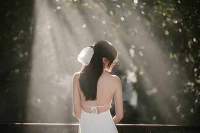 Woman in White Dress Gazing Through Sunlit Forest - free wallpaper 6144×4096
