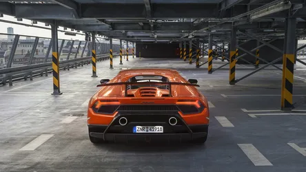 Orange Lamborghini Huracán Parked in Urban Garage - free cars & vehicles wallpaper 1920×1080