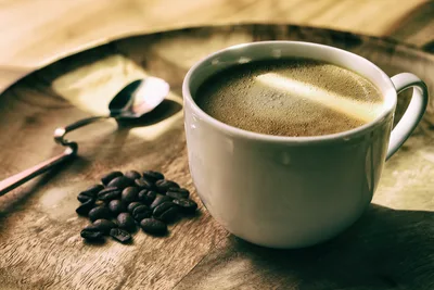 White Coffee Mug With Black Coffee Beans on Wood - free food wallpaper 6000×4000
