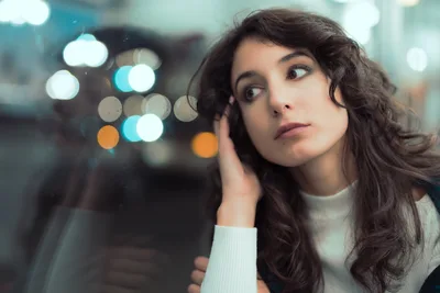 Woman in White Sweater by Blurred City Lights - free wallpaper 5568×3712