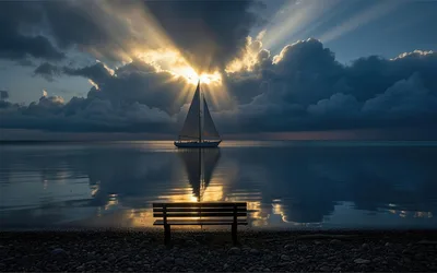 Sailboat at Sunset with Bench on Rocky Shore - free landscapes wallpaper 2876×1800