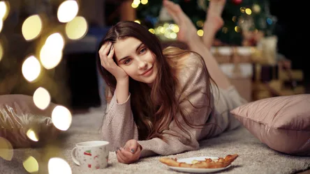 Woman Relaxing by Warm Lights with Holiday Treats - free people & portraits wallpaper 6144×3456