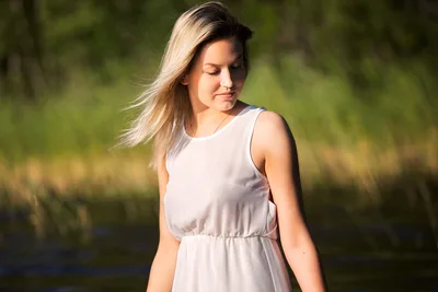 Woman in White Dress by Water at Sunset - free wallpaper 2048×1365