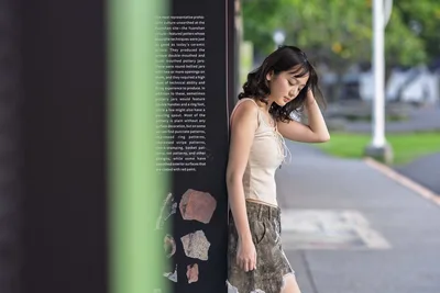 Young Woman Posing Against Educational Display Panel - free people & portraits wallpaper 5120×3413