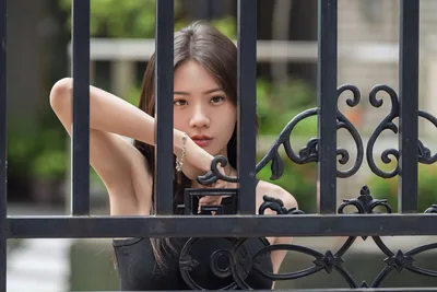 Woman Behind Ornate Black Iron Gate - free wallpaper 5120×3413