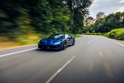 Blue Sports Car Driving On Curved Forest Road - free wallpaper 6720×4480