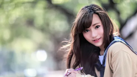 Young Woman Smiling Outdoors with Blurred Background - free people & portraits wallpaper 5760×3240