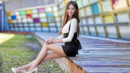 Woman Sitting on Wooden Ledge at Stadium - free people & portraits wallpaper 5120×2880